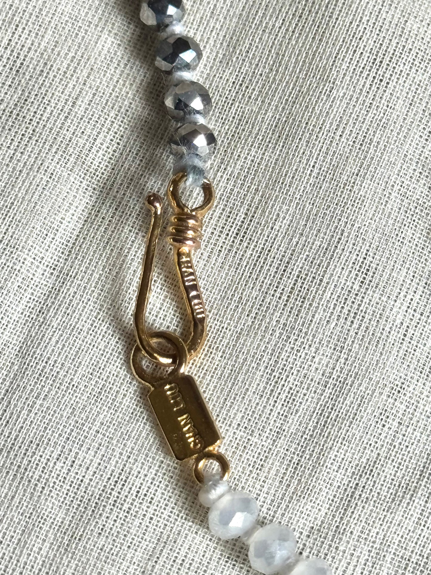 Chan Luu - Hand Knotted Aurora Borealis Grey and Opaque White Crystal Necklace/Bracelet with Gold Chain￼