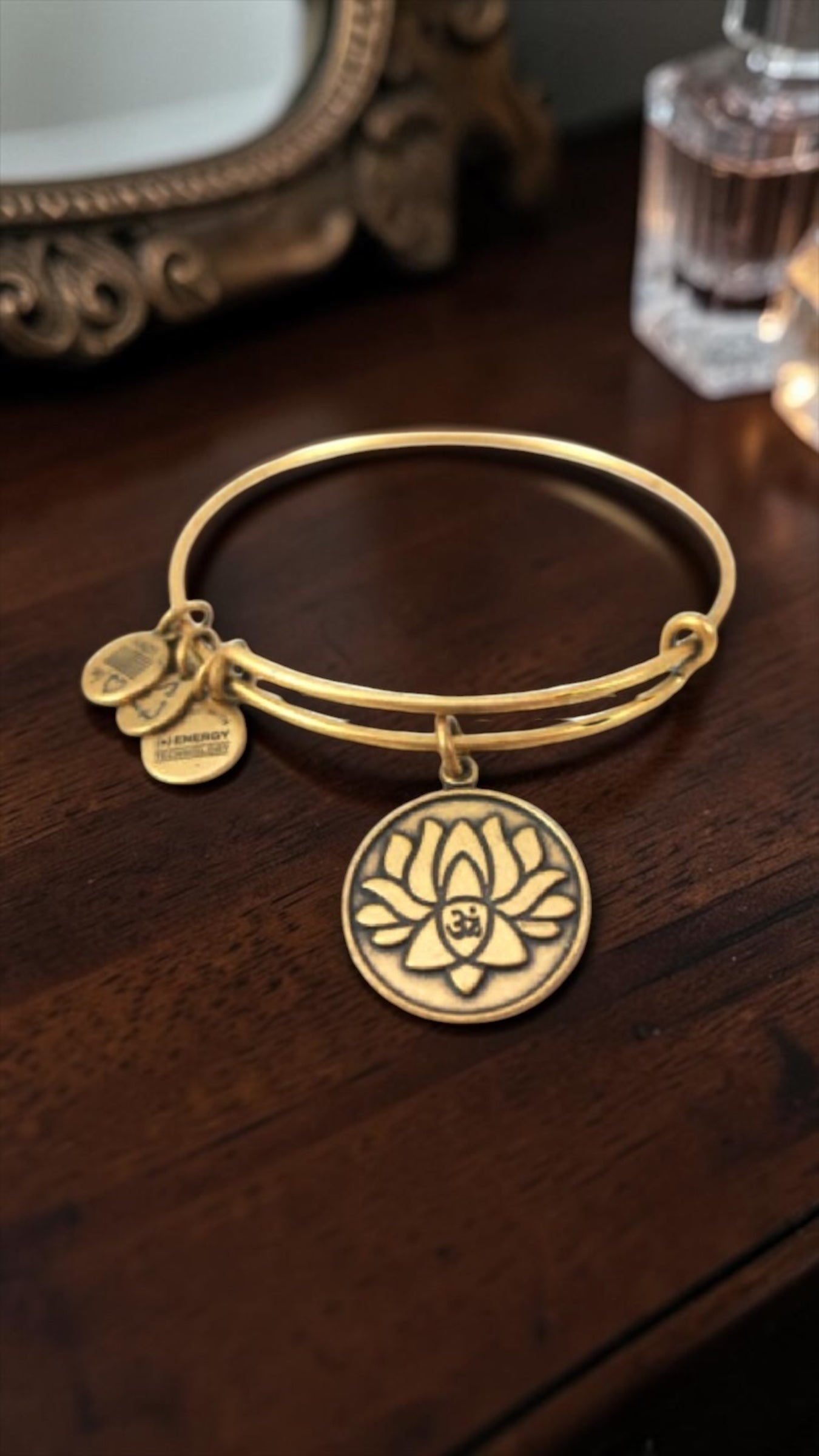 Alex and Ani - New Beginnings, Lotus With Ohm Symbol Charm Bangle Bracelet