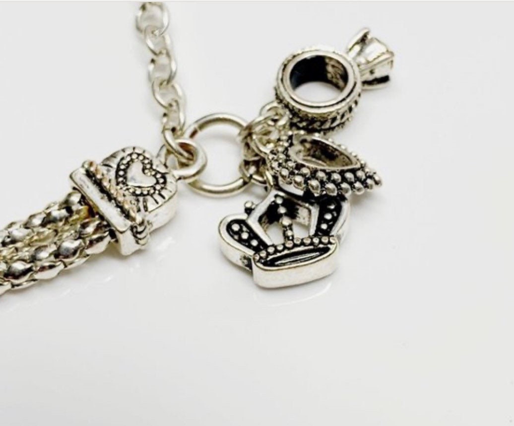 Premier Designs Charm Silver Tone Bracelet, Charms Dangling Hearts, Cross, Crown, Ring Charm with Crystal Closes with Lobster Clasp